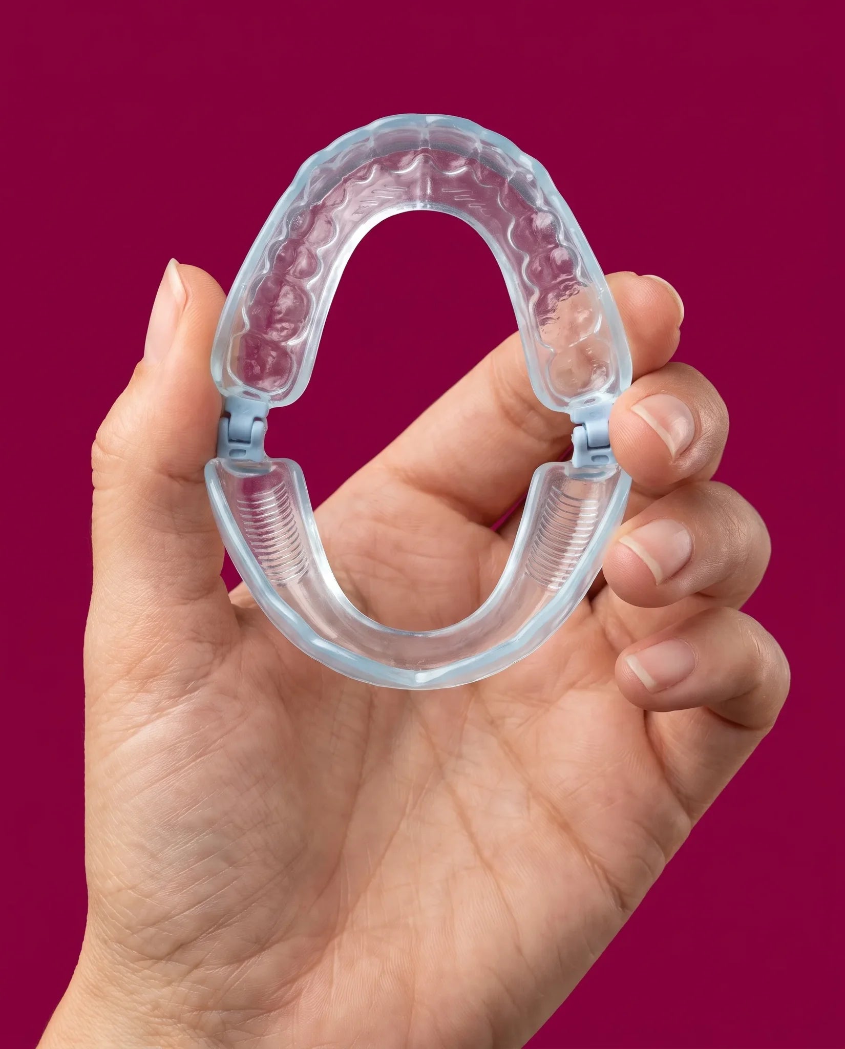 Orbique AirCurve held gently in a woman's hand
